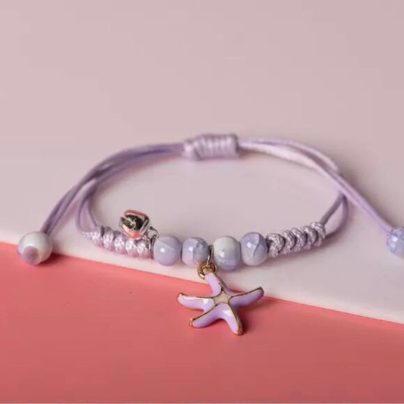 105 - 2 ADJUSTABLE BEADED, GLAZED CHARM, CORDED BRACELETS - Picture 2 of 3